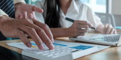 Close-up of businessman discussing graphs photo