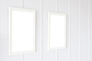 Blank frames on white wall background photo
