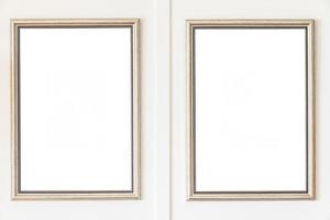 Blank frames on white wall background