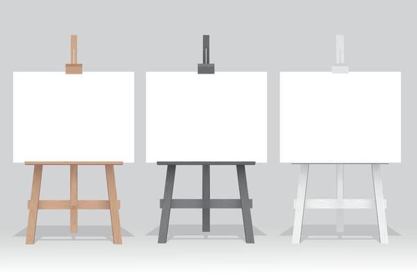 Wooden easel stand with blank canvas on white background
