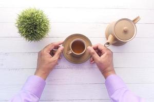 Pouring tea from above photo