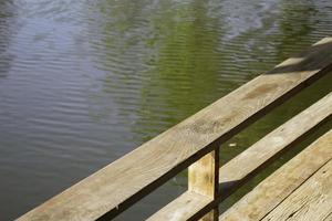 Wooden pier by the lake photo
