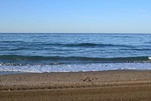 The beach in the morning of a summer day photo