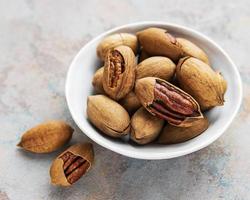 Pecan nuts in the bowl photo