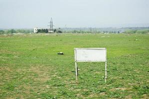Land for sale. White advertisement board with copy space for text. photo