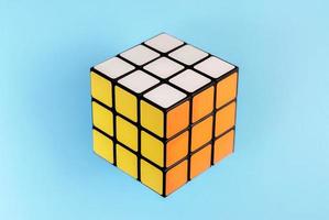 Rubik's cube on blue background. photo