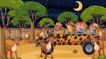 Safari en la escena nocturna con muchos niños viendo un grupo de ciervos. vector