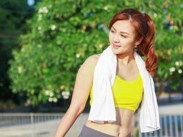 Beautiful woman exercising outdoors in the park photo
