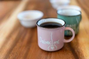 Cup of brewed black coffe on the wooden table photo