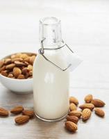 Almond milk and almonds photo