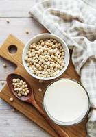 Soy milk and soy on the table photo