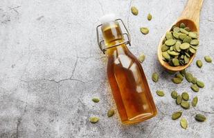 Bottle with pumpkin seed oil photo
