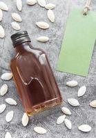 Bottle with pumpkin seed oil photo