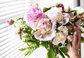 Beautiful pink peony bouquet in a vase. photo