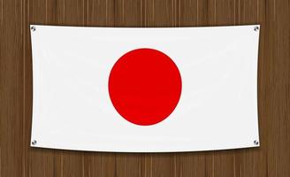 Bandera de Japón sobre un fondo de pared de madera oscura vector