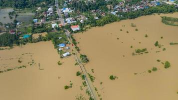 Aerial top view of flooded rice paddies and the village photo