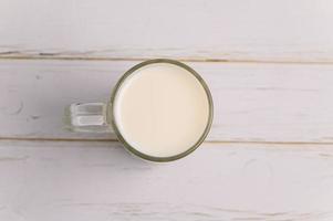 A glass of milk on the desk photo