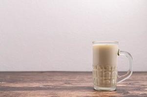 A glass of milk on the desk photo