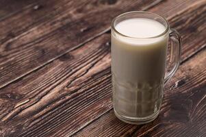 A glass of milk on the desk photo