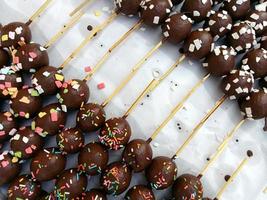 Sweet donut balls piled on a white plate photo