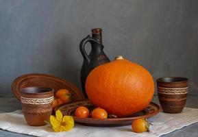 Autumn still life with pumpkin and nasturtium flowers. photo