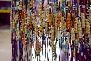 Bracelets with letters on the shop window. photo