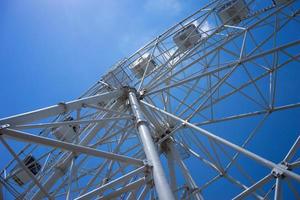 Beautiful and modern Ferris wheel on blue sky background. photo