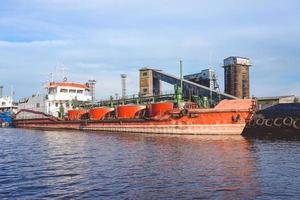 Port of a large Russian city with ships and various equipment photo