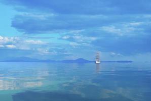 Seascape with a beautiful sailboat on the horizon. photo