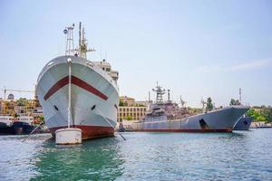 Seascape with a ship in the Sevastopol Bay against the blue sky. photo