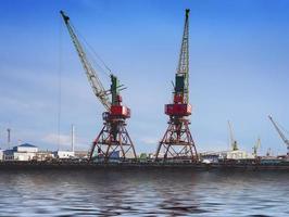 Port of a large Russian city with ships and various equipment on photo