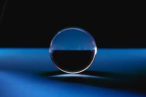 A low key image of a lens ball in abstract blue photo