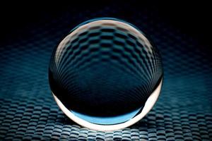 Abstract glass ball in dark turquoise tone photo