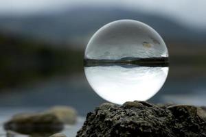 Landscape seen through the lens ball. photo