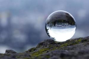 Landscape seen through the lens ball. photo