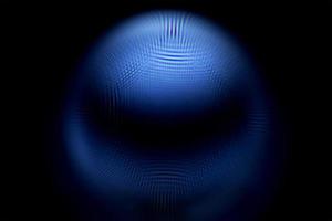 An abstract sphere with a blurry pattern isolated on black background. photo