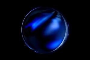 An abstract sphere with a blurry pattern isolated on black background. photo