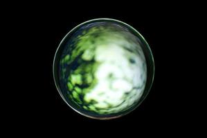 An abstract sphere with a blurry pattern isolated on black background. photo