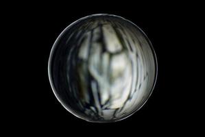 An abstract sphere with a blurry pattern isolated on black background. photo