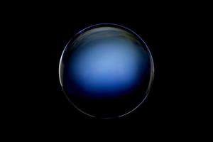 An abstract sphere with a blurry pattern isolated on black background. photo