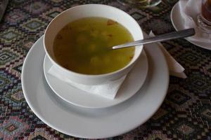 Azerbaijani national cuisine in white dish soup dushbara photo