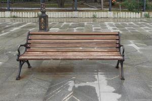 Cityscape with a wooden bench photo