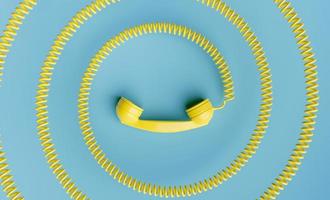 Telephone handset with coiled cord towards the center of the image photo