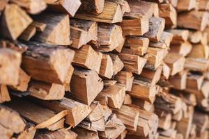 Stacked firewood background photo