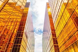 Golden tall buildings and glass reflections in Hong Kong Island, business concepts of buildings and architecture photo
