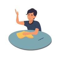 un niño feliz se sienta en un escritorio y responde a un examen escolar aislado en un fondo blanco. el estudiante levanta la mano, listo para tomar el examen.Ilustración de vector en un estilo de caricatura plana.