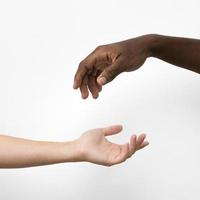Multiracial hands coming together photo