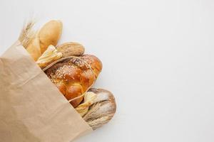Paper bag with variety of bread photo
