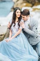 Young couple in love on a mountain river photo