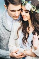 Young couple in love on a mountain river photo